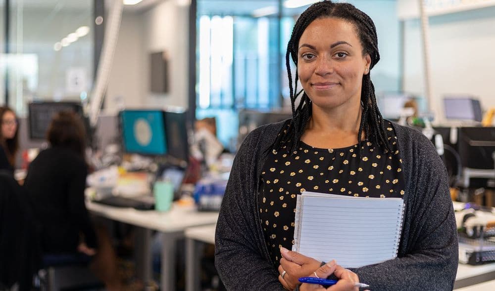 lady in a recruitment office with a notebook