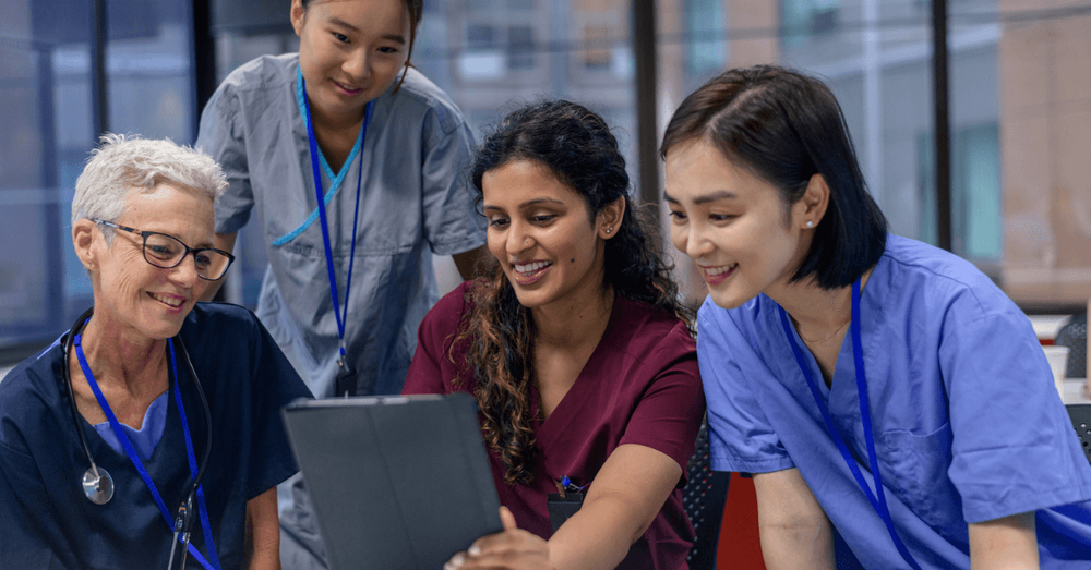 Doctors looking at an iPad
